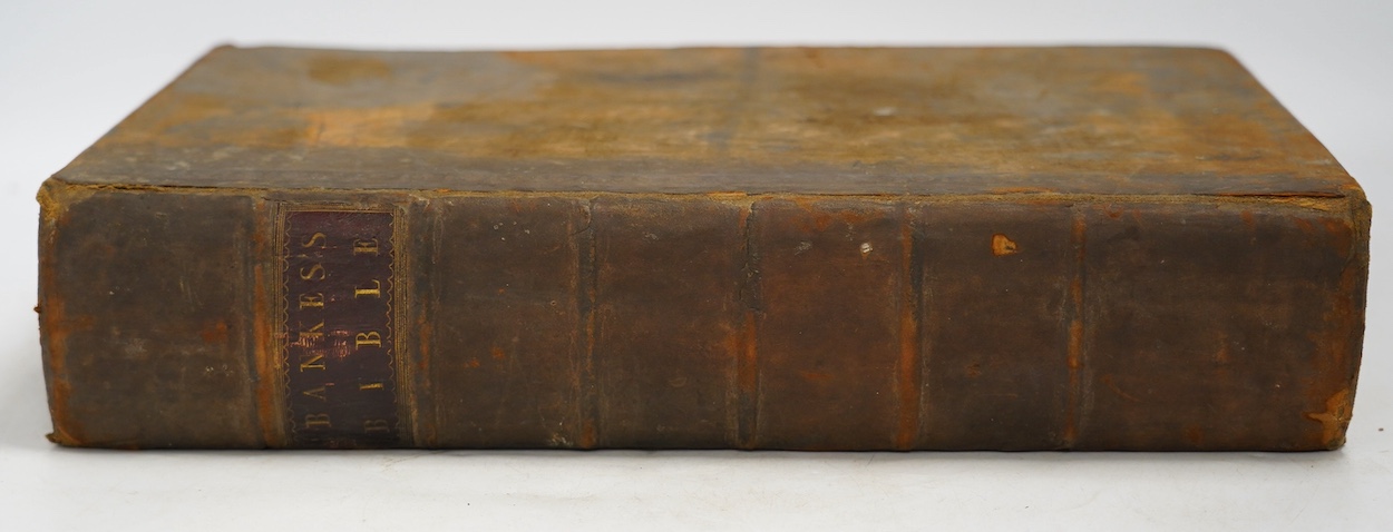 An 18th century leather bound family bible with plates. Condition - poor to fair
